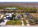 Aerial view of the property showcasing the home's layout, large lot, surrounding neighborhood, and mature trees at 10416 Pocket Ln, Orlando, FL 32836