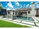 Lush backyard featuring a modern pool, patio, and elegant outdoor living space at 10416 Pocket Ln, Orlando, FL 32836