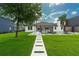 Sprawling backyard featuring pool, patio, and lush landscaping, perfect for outdoor living at 10416 Pocket Ln, Orlando, FL 32836