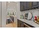 Stylish bar area with custom cabinetry, wine storage, and beverage fridge at 10416 Pocket Ln, Orlando, FL 32836