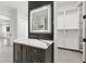 Stylish bathroom vanity with marble countertop, modern fixtures, and sleek tiled wall at 10416 Pocket Ln, Orlando, FL 32836