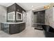 Modern bathroom with a large vanity with double sinks, a soaking tub, and a glass enclosed shower at 10416 Pocket Ln, Orlando, FL 32836