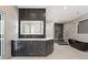Modern bathroom with double sink vanity, stylish black accent tiles, a soaking tub, and glass enclosed shower at 10416 Pocket Ln, Orlando, FL 32836