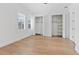 Bright bedroom featuring hardwood floors, plantation shutters and closets with ample storage at 10416 Pocket Ln, Orlando, FL 32836