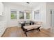 Cozy dining area with a built-in bench, custom lighting, and views of the backyard at 10416 Pocket Ln, Orlando, FL 32836