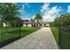 Charming home with an expansive green lawn, an elegant driveway, and secure fencing at 10416 Pocket Ln, Orlando, FL 32836