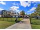 Beautiful home featuring a fenced yard, a long driveway, and professional landscaping at 10416 Pocket Ln, Orlando, FL 32836