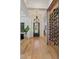 Bright foyer featuring a wine cellar, chandelier, and beautiful light wood floors at 10416 Pocket Ln, Orlando, FL 32836