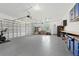 Spacious garage with epoxy flooring, lots of storage space, and overhead doors at 10416 Pocket Ln, Orlando, FL 32836