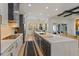 Modern kitchen with a large island, stainless steel appliances, and an open concept layout at 10416 Pocket Ln, Orlando, FL 32836