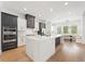 Bright, modern kitchen with a marble island, stainless steel appliances, and a spacious open floor plan at 10416 Pocket Ln, Orlando, FL 32836