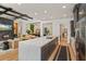 Spacious kitchen with a large island, modern appliances, gray cabinets, and hardwood floors at 10416 Pocket Ln, Orlando, FL 32836