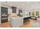 Bright kitchen featuring an island with seating, breakfast nook, and stainless steel appliances at 10416 Pocket Ln, Orlando, FL 32836