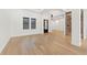Elegant living room with hardwood floors, modern lighting, and a stylish wine rack at 10416 Pocket Ln, Orlando, FL 32836