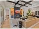 Open living room with a fireplace, custom ceiling, and hardwood floors at 10416 Pocket Ln, Orlando, FL 32836