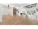 Spacious living room with hardwood floors, tray ceiling, wine rack, and sliding doors to the outdoor patio at 10416 Pocket Ln, Orlando, FL 32836