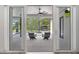 Covered patio with outdoor seating overlooking the pool and landscaped backyard at 10416 Pocket Ln, Orlando, FL 32836