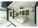 Covered patio boasts sleek design with comfortable seating and modern finishes at 10416 Pocket Ln, Orlando, FL 32836