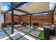 Outdoor pergola area featuring a built-in grill, seating area, and privacy screens at 10416 Pocket Ln, Orlando, FL 32836