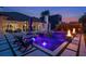 Backyard pool with fire bowls, an integrated spa, lounge chairs, and stylish concrete pavers at 10416 Pocket Ln, Orlando, FL 32836