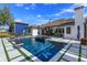 Backyard pool featuring lounge chairs, outdoor living, and professional landscaping at 10416 Pocket Ln, Orlando, FL 32836