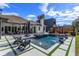 Backyard pool featuring lounge chairs, outdoor living, and professional landscaping at 10416 Pocket Ln, Orlando, FL 32836