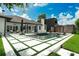 Stunning backyard pool area with modern tile design, outdoor seating, and sleek architectural features at 10416 Pocket Ln, Orlando, FL 32836