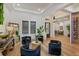 Sitting area with decorative mirrors, hardwood floors, and a statement light fixture at 10416 Pocket Ln, Orlando, FL 32836
