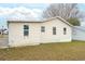 This home features a well maintained back yard with siding at 1207 Palmetto Dr, Lady Lake, FL 32159