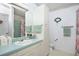 Clean bathroom with single sink vanity, shower, and bathtub at 1207 Palmetto Dr, Lady Lake, FL 32159