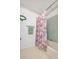 Bathroom with shower/tub combo and floral shower curtain at 1207 Palmetto Dr, Lady Lake, FL 32159