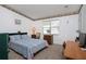 Charming bedroom with double bed, desk, and ample natural light at 1207 Palmetto Dr, Lady Lake, FL 32159