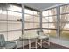 Bright sunroom with table and chairs, offering ample natural light and relaxing views at 1207 Palmetto Dr, Lady Lake, FL 32159