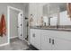 Double vanity bathroom with granite countertop and walk in shower at 1231 Citrus Landings Blvd, Davenport, FL 33837