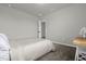 Simple bedroom with carpeted floor and neutral walls at 1231 Citrus Landings Blvd, Davenport, FL 33837