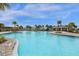 Relaxing community pool with lounge chairs and shaded areas at 1231 Citrus Landings Blvd, Davenport, FL 33837