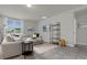 Bright living room featuring a comfy sectional sofa and stylish shelving unit at 1231 Citrus Landings Blvd, Davenport, FL 33837