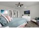 Main bedroom with a king-size bed and en-suite bathroom access at 1231 Citrus Landings Blvd, Davenport, FL 33837