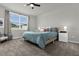 Main bedroom with a large bed, plenty of natural light, and ceiling fan at 1231 Citrus Landings Blvd, Davenport, FL 33837