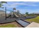 Modern playground with slides, climbing structures, and ADA access at 1231 Citrus Landings Blvd, Davenport, FL 33837