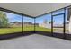Relaxing screened patio with access to the backyard at 1231 Citrus Landings Blvd, Davenport, FL 33837