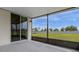 Spacious screened patio overlooking a grassy backyard at 1231 Citrus Landings Blvd, Davenport, FL 33837