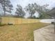 Spacious backyard with wooden fence and patio at 12703 Whiterapids Dr, Orlando, FL 32828