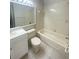 Bathroom with tub, toilet and vanity with mirror at 12703 Whiterapids Dr, Orlando, FL 32828