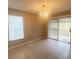 Dining room with tile flooring and sliding glass doors at 12703 Whiterapids Dr, Orlando, FL 32828