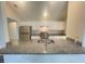 Modern kitchen with granite countertops and stainless steel appliances at 12703 Whiterapids Dr, Orlando, FL 32828