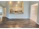 Living room features an open floor plan and wood-look floors at 12703 Whiterapids Dr, Orlando, FL 32828