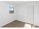 Bright bedroom with wood-look floors and a spacious closet at 137 Scott Dr, Sanford, FL 32771