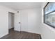 Bedroom with hardwood floors, window, and closet at 137 Scott Dr, Sanford, FL 32771