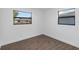 Spacious bedroom with hardwood floors and two windows at 137 Scott Dr, Sanford, FL 32771